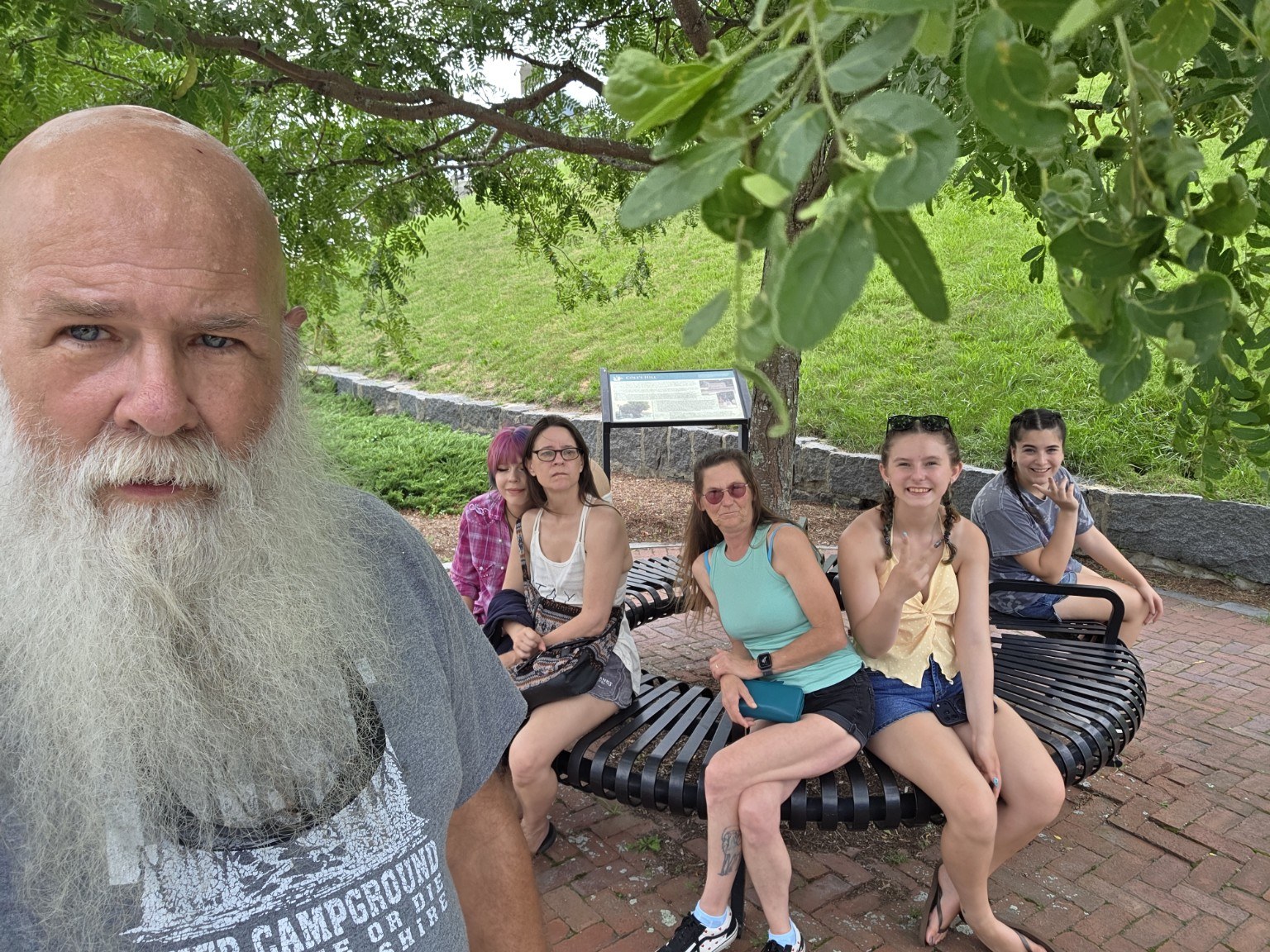 Trail Tater crew resting on a bench