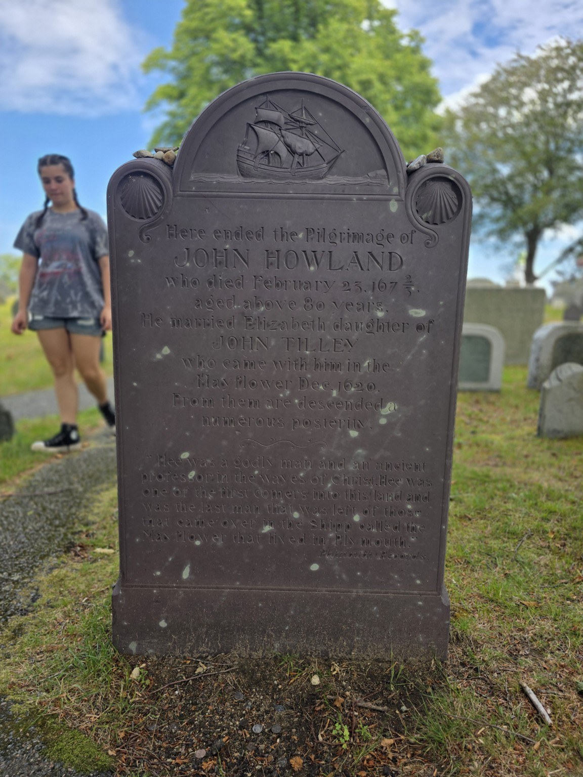 John Howland memorial with a carved ship