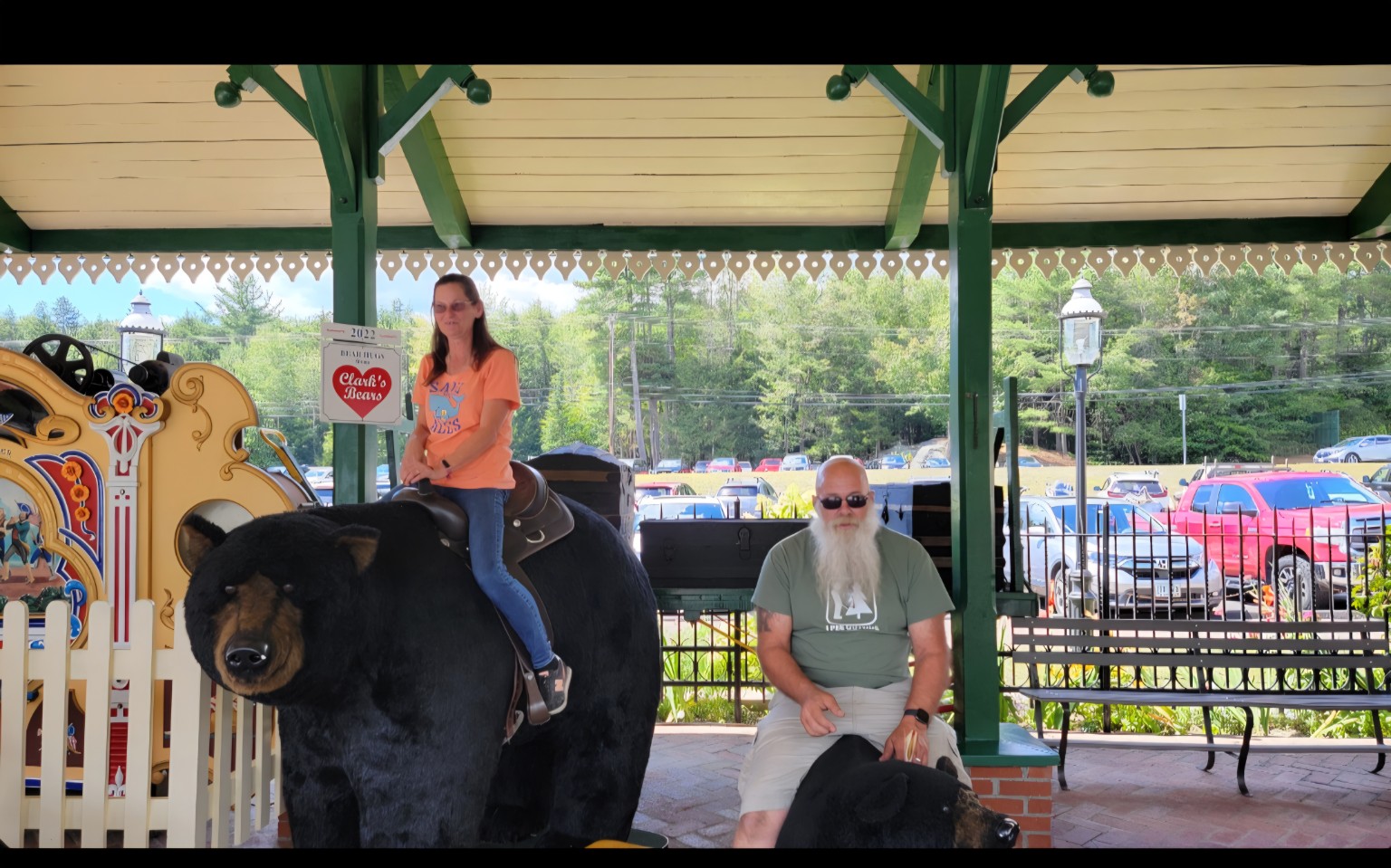 Two adults posing with bear photo props at Clark's Bears