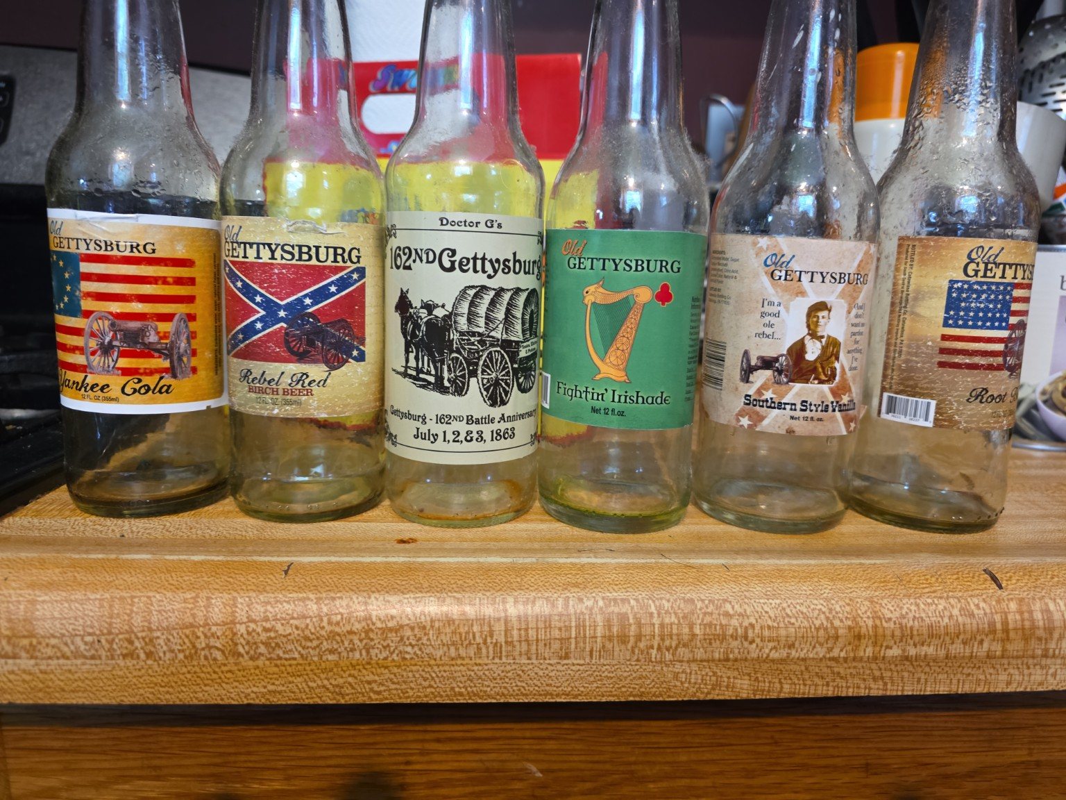 Six collectible Old Gettysburg soda bottles lined up together