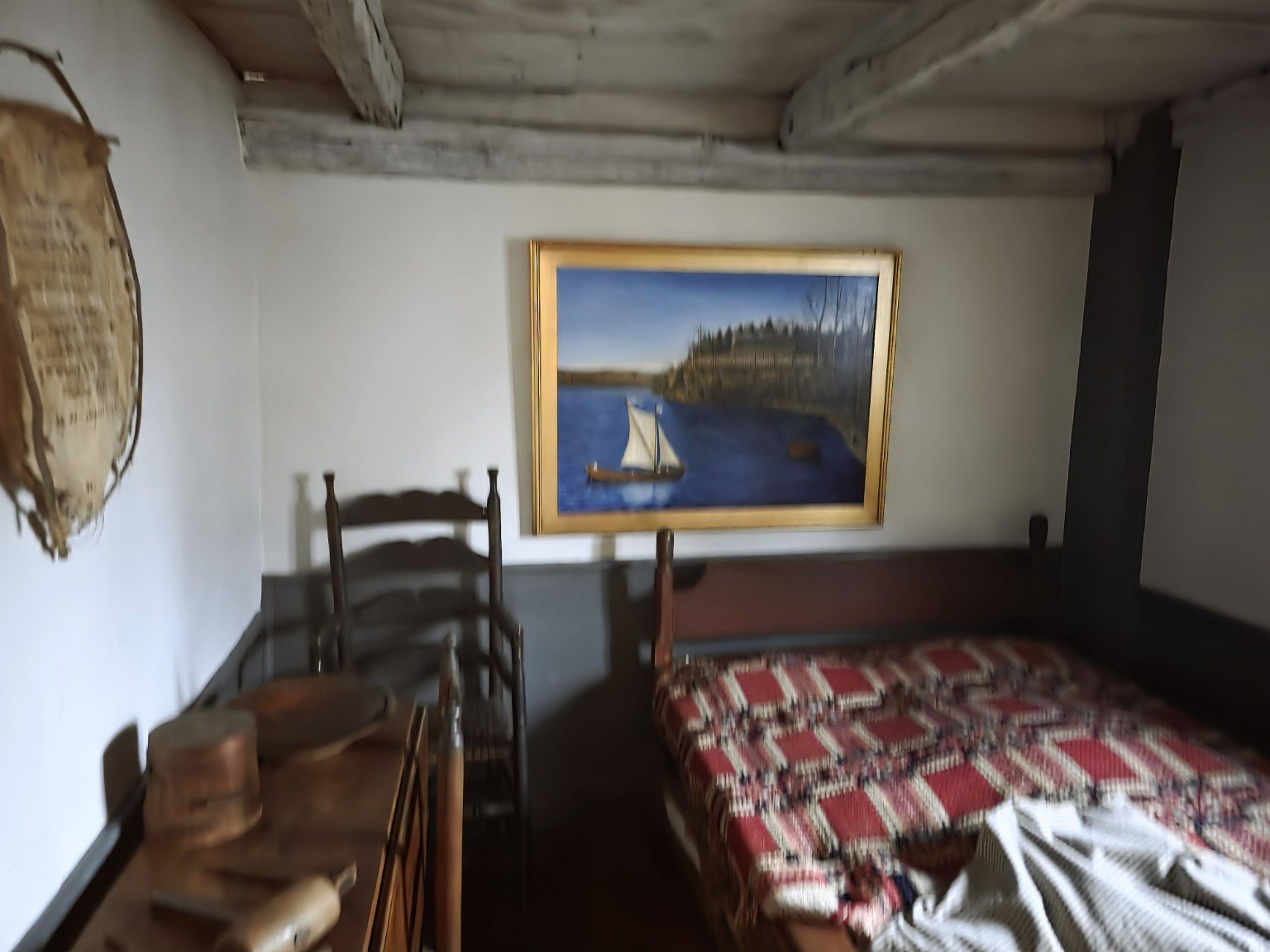 Small historic bedchamber with curtained bed