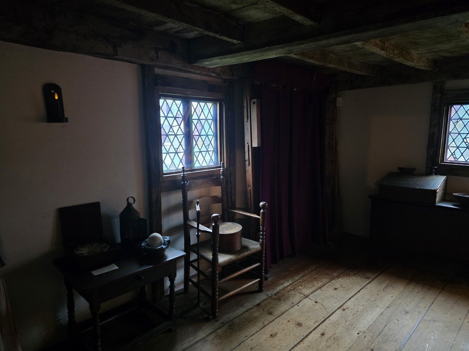 Quiet room with old chairs and diamond-pane windows