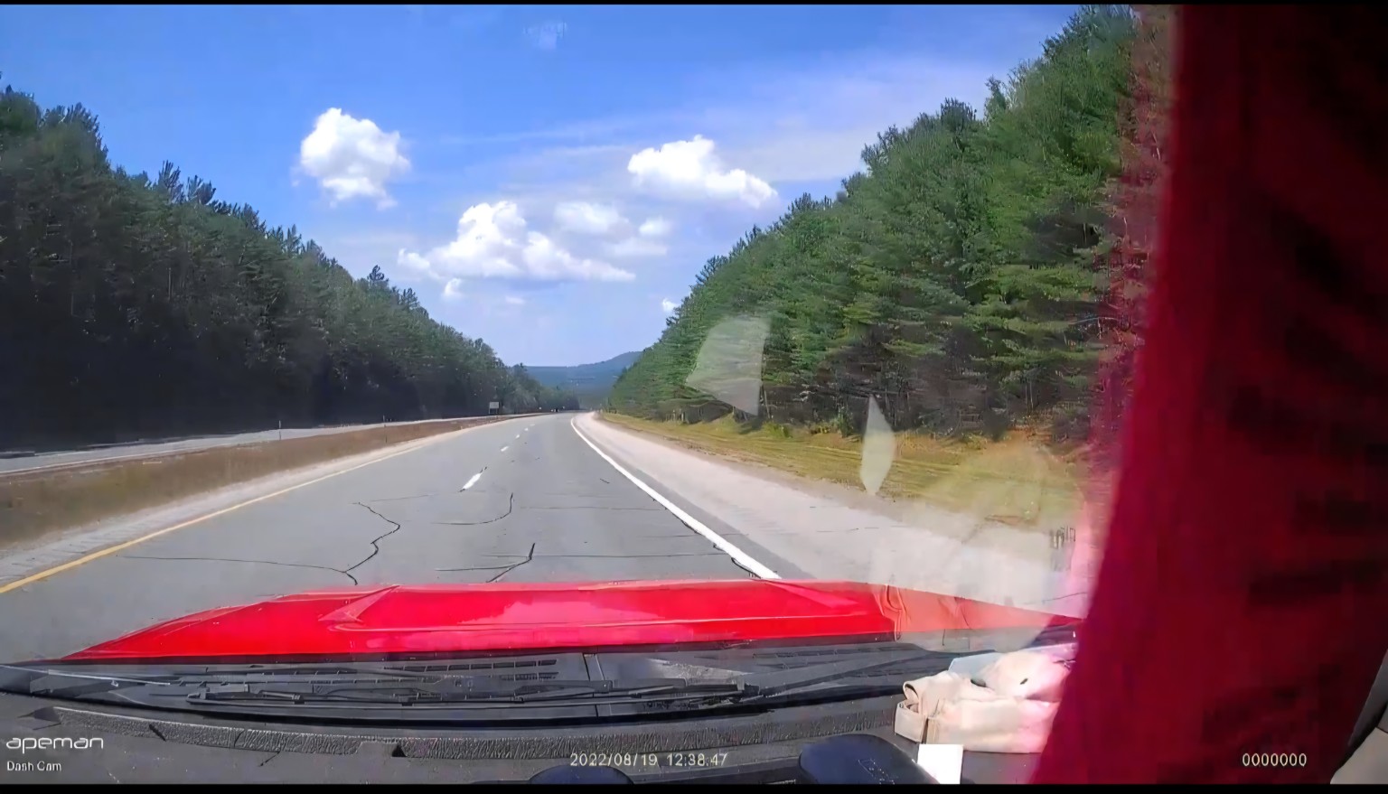 The road north through the wooded White Mountains