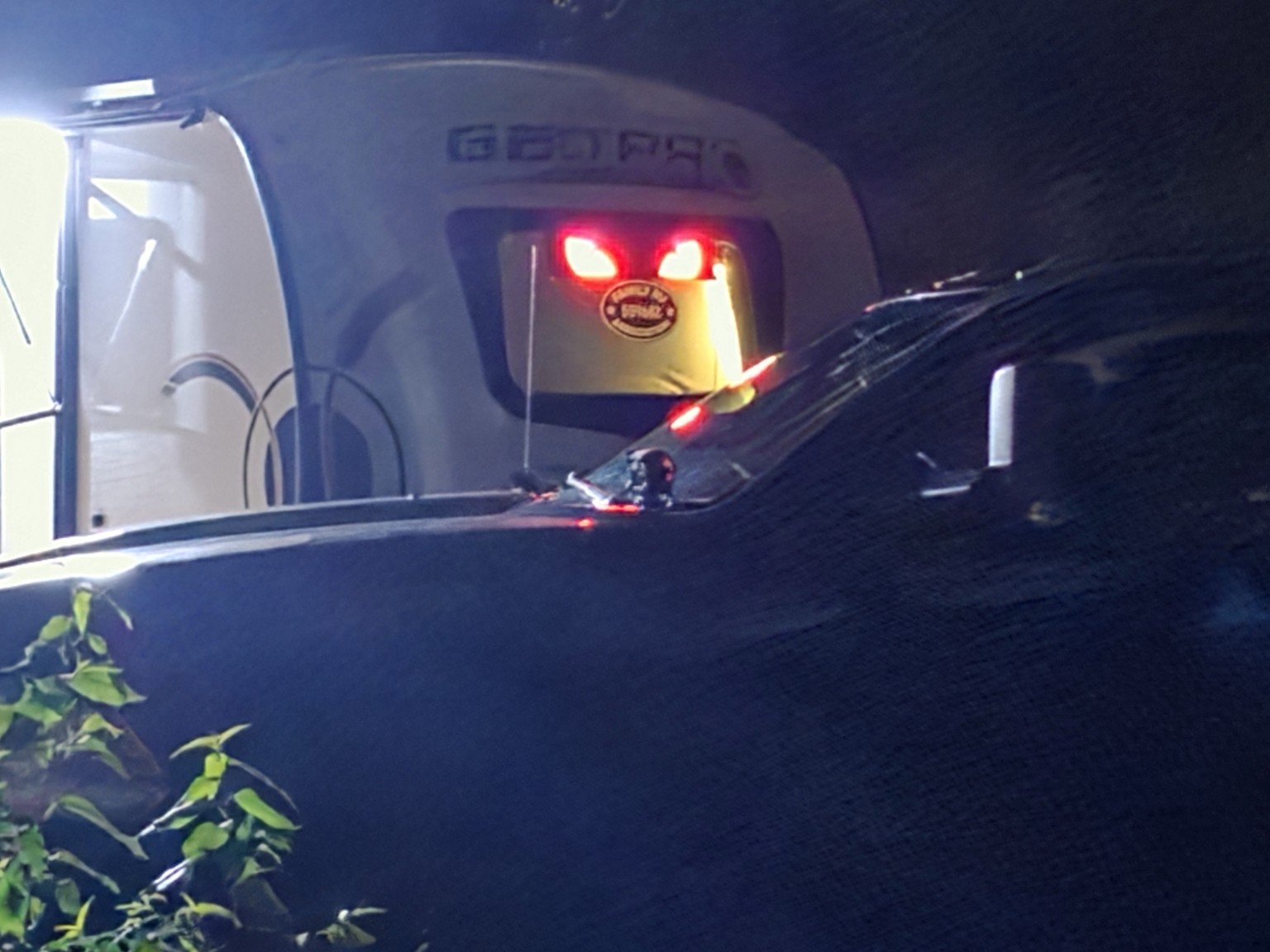 Close nighttime view of Trail Tater's glowing red eyes