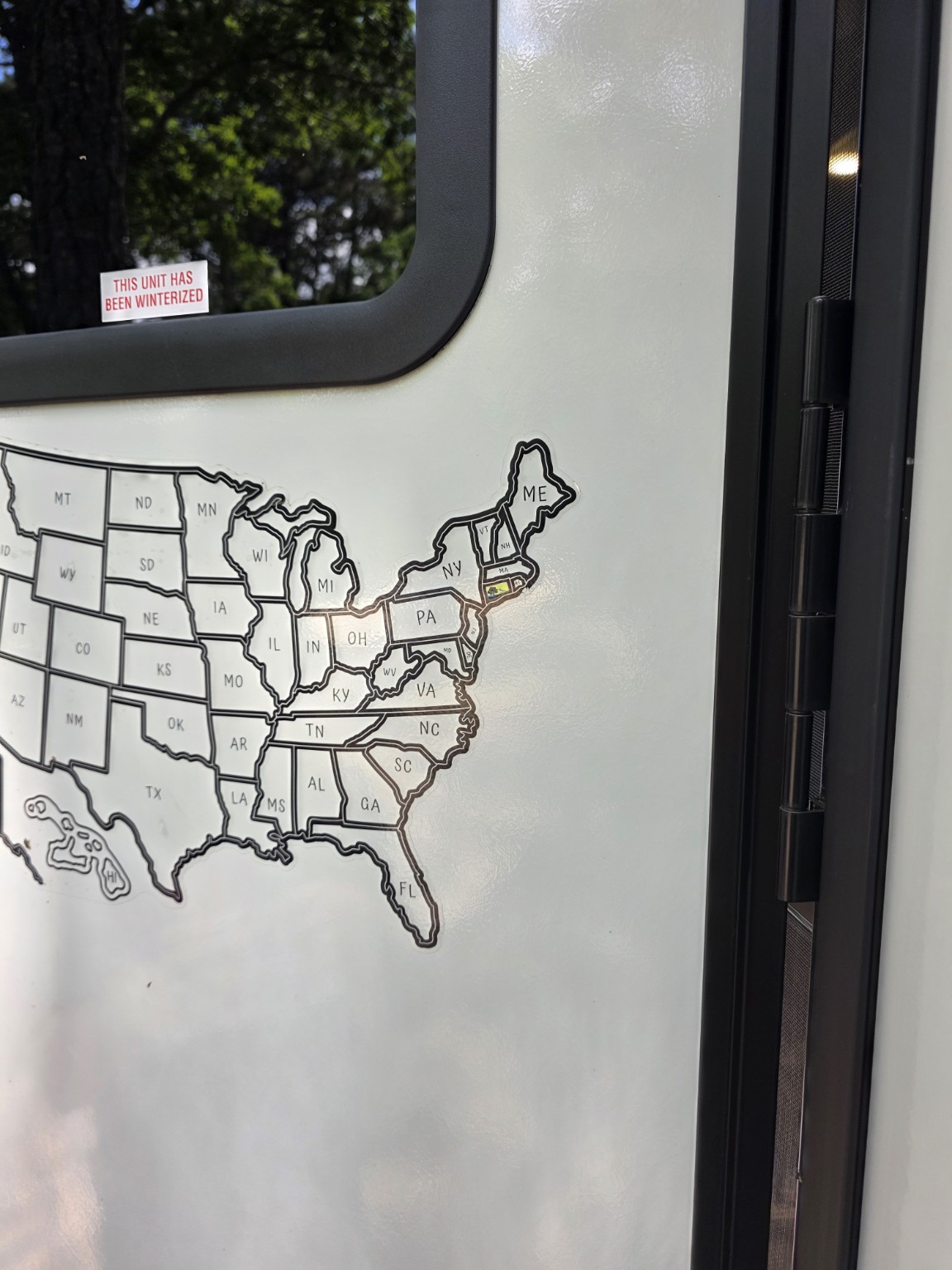 Massachusetts state sticker ready to be added to Trail Tater's travel map